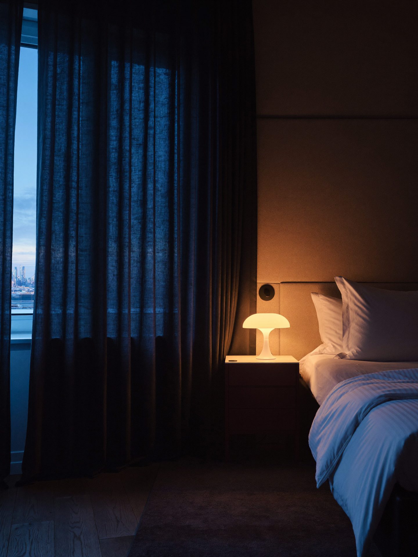 Serene bedroom with blackout curtains at dawn